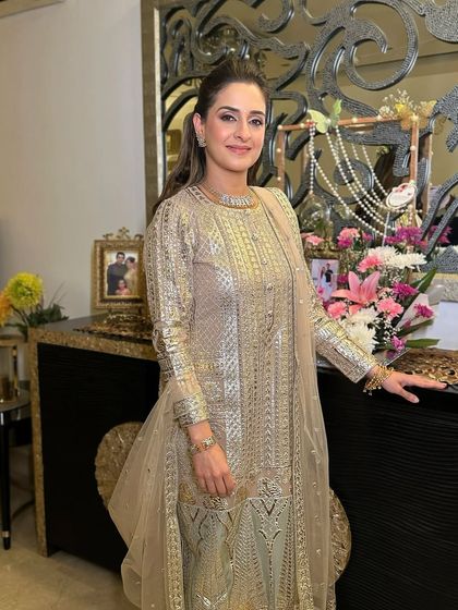 The full look, showing how a soft, shimmery makeup style can be incredibly flattering and sophisticated for the mother of the bride or groom.