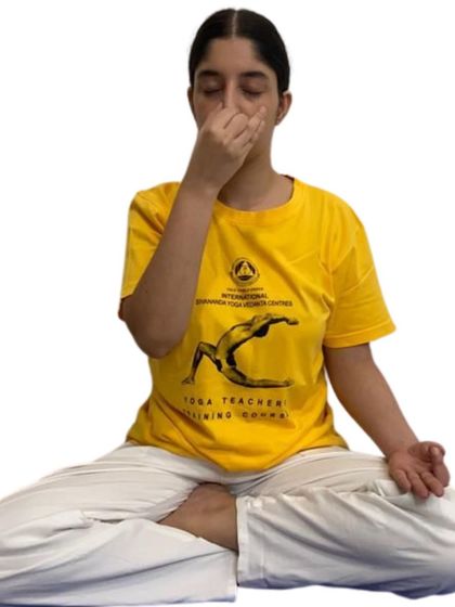 A clear demonstration of the alternate nostril breathing technique. Our workshops break down each step so you can confidently practice at home to balance your energy.