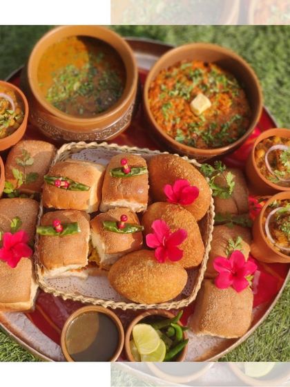 Our Chatpata Platter is a true crowd pleaser. This version features vada pav, pav bhaji, and chole, garnished with bright pink flowers for an extra touch of beauty.