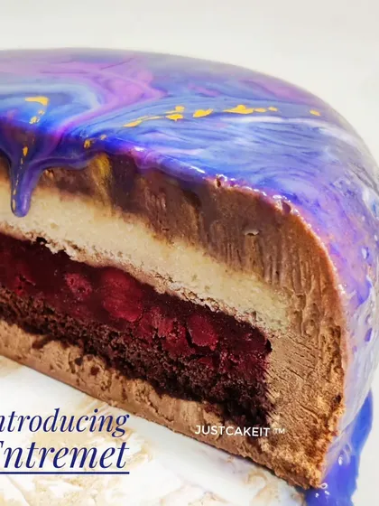 I also create luxurious French desserts like this egg-free Entremet. This cross-section reveals the complex layers of creamy mousse, rich cake, and fruit jelly that make each bite a unique experience.