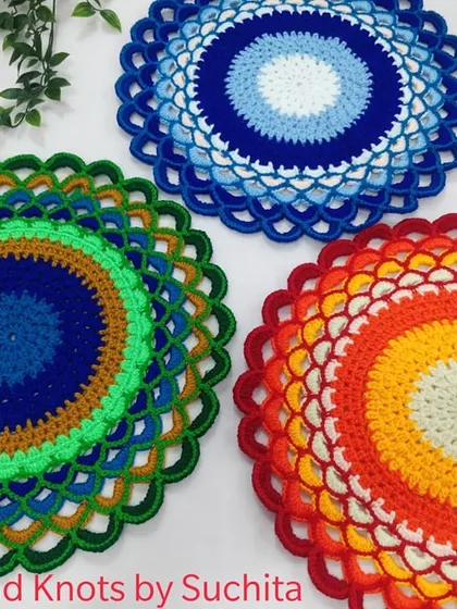 A completed custom order for these colorful doilies. The customer chose a peacock design, an evil eye pattern, and a sunset gradient.