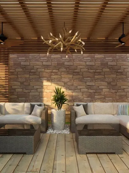 Another view of the rustic-modern outdoor lounge. The combination of natural stone, wood, and comfortable seating makes this a perfect spot to unwind day or night.