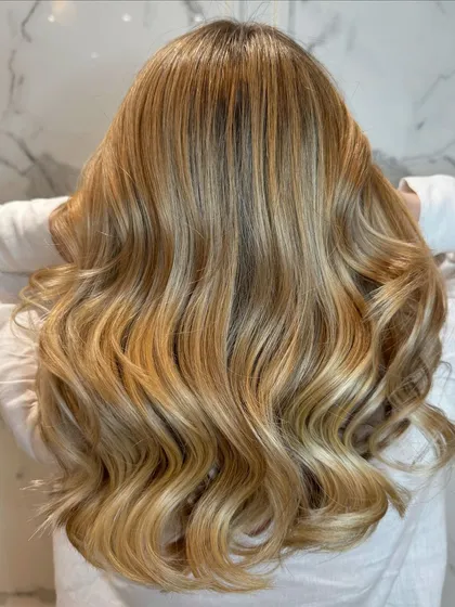 The back view shows the full, multi-dimensional effect of this pearl blond balayage.