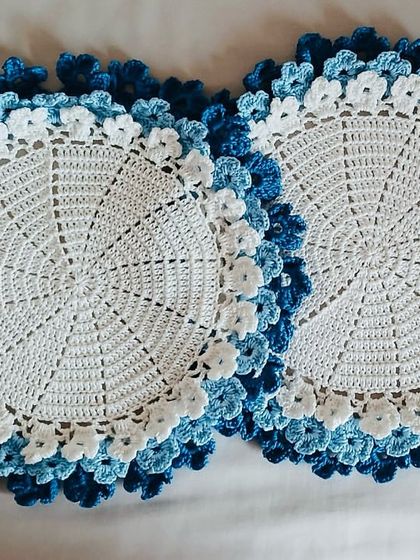 A closer look at the placemats with layered blue floral borders. The different shades of blue create a lovely gradient effect.