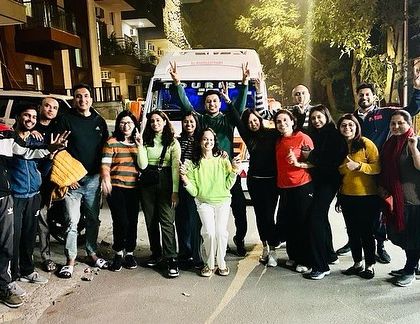 The journey begins. Our excited group ready to depart for the Manali retreat. The energy and anticipation for the adventure ahead are clear to see.