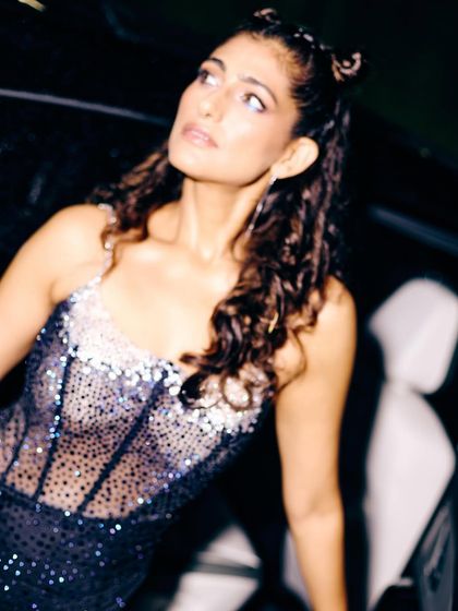 A close-up on the embellished details of the dress for Kubbra Sait's character. The stardust effect of the fabric was meant to make her shine on screen, reflecting her larger-than-life personality.