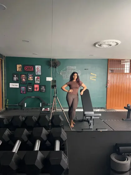 Leaning on the bench after a tough set. The gym is my sanctuary and my playground.
