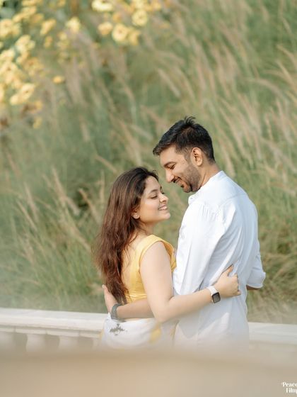 A pre-wedding portrait filled with warmth and affection. The couple's loving gaze and the beautiful natural light create a timeless and romantic image.
