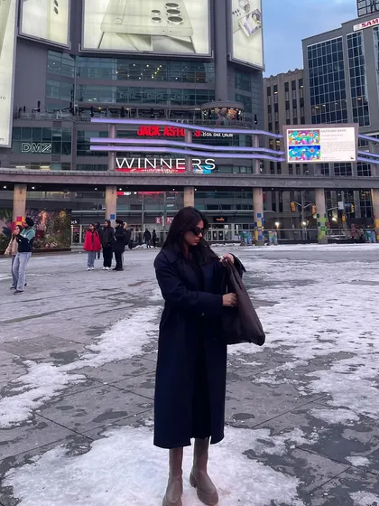 A candid moment checking my bag in the middle of Dundas Square.