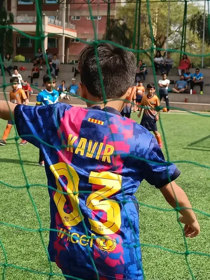 A player stands guard at the goal during the Youth Super Cup. We encourage our players to have fun and enjoy the experience.