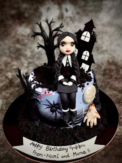 The full Wednesday-themed cake, a perfect blend of cute and creepy for a memorable birthday celebration.