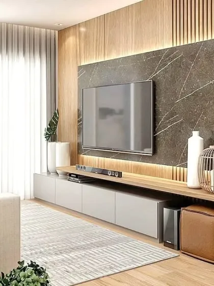 This TV unit combines a dark marble panel with light wood fluting, creating a dramatic and textured feature wall.
