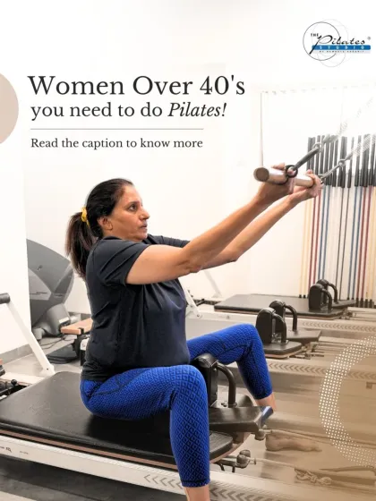 A client demonstrates an arm exercise on the reformer. For women over 40, Pilates is a perfect way to build strength, improve posture, and support joint health in a safe and effective manner.