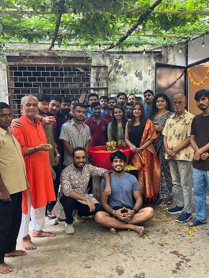 The studio community poses for a group photo after the visarjan. There's a sense of fulfillment and togetherness after celebrating the festival in a meaningful and eco-conscious way.