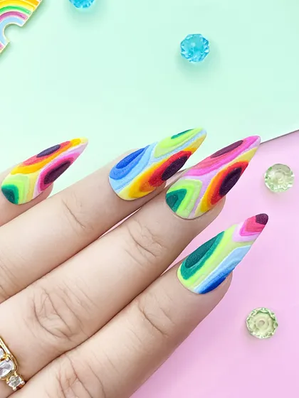 Explore your creativity with advanced materials. This vibrant, abstract design was created using colored acrylic powders, showcasing one of the many advanced techniques you'll master in our courses.