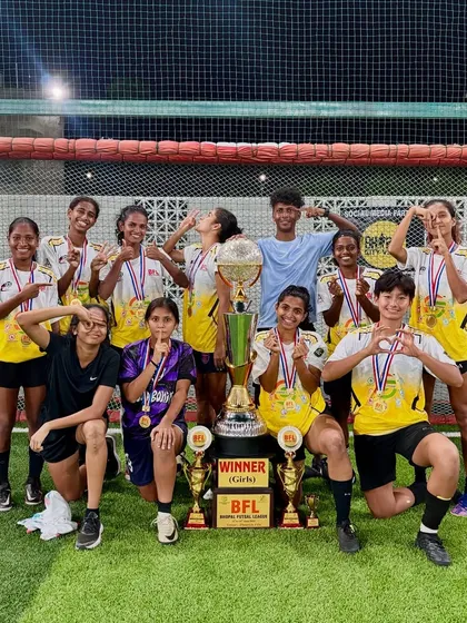 Our team celebrating their BFL championship win in Bhopal, showcasing the trophy and medals.