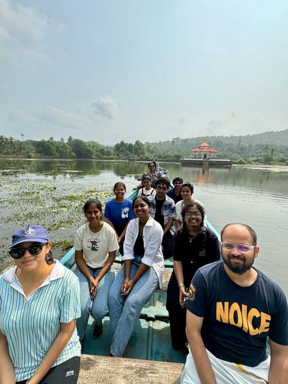 Another happy group enjoying the boat ride in the calm waters of a lake near the coast.
