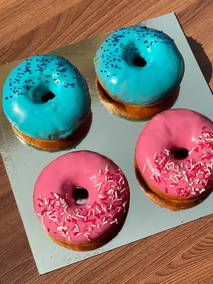 Blue and pink glazed donuts for a gender reveal party. I can customize the colors to match any theme.