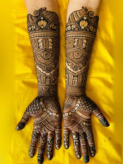 The lotus is a central element in this design, symbolizing purity and beauty. It's surrounded by intricate patterns that create a sense of depth and elegance.