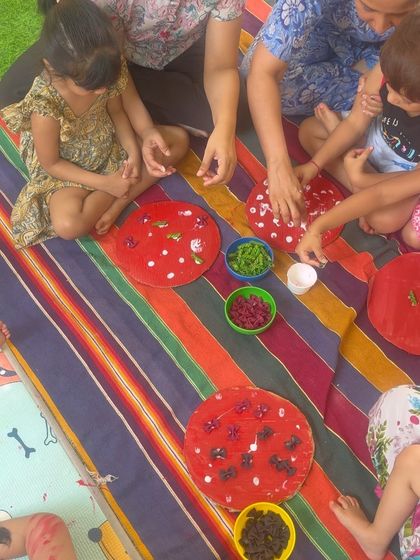 Art and craft activities like this one, where children decorate a surface with natural items, are fantastic for developing fine motor skills and an appreciation for different textures and colors.