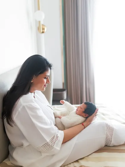Precious moments at home. A relaxed lifestyle shot of a mother admiring her baby in the soft, natural light of her bedroom.