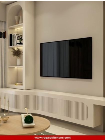 A soft and minimalist TV unit with a curved console and arched open shelving. The light wood and white color palette creates a calm and inviting atmosphere.