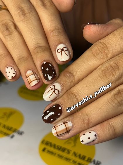 The perfect "Latte Girl" aesthetic. This cozy set features hand-painted bows, polka dots, and plaid patterns in shades of chocolate brown and cream for a look that's timelessly chic.