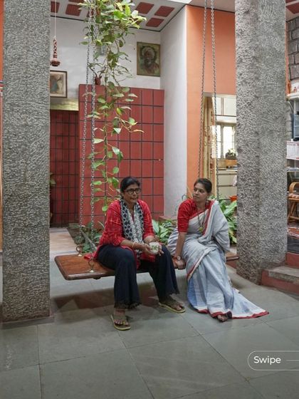 A quiet moment on the indoor swing at the Dr. Rehamat Residence. The swing, suspended between two massive granite pillars, is the heart of the home's central courtyard, a place for conversation and connection.