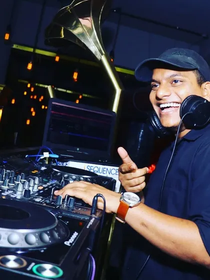 This is me in my element, absolutely loving the music and the energy from the crowd. I believe a great party starts with a DJ who is passionate about every track they play. I bring this level of excitement to every single event.