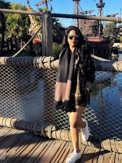 A day at Disneyland Paris calls for a fun and comfortable outfit. A camouflage jacket over a black dress with white sneakers is perfect for a long day of walking and adventure.