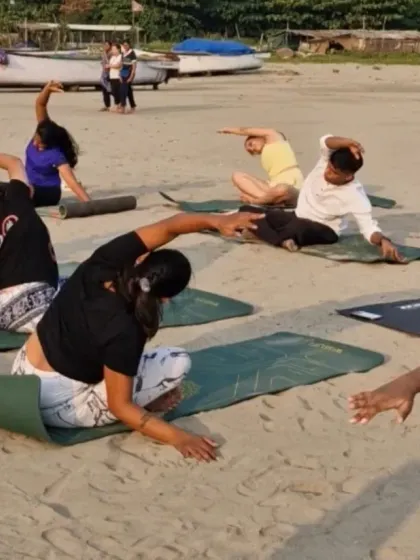 Flowing together with the rhythm of the waves. This side-body stretch feels incredible when you're grounded in the soft sand, connecting your movement to the natural world around you.