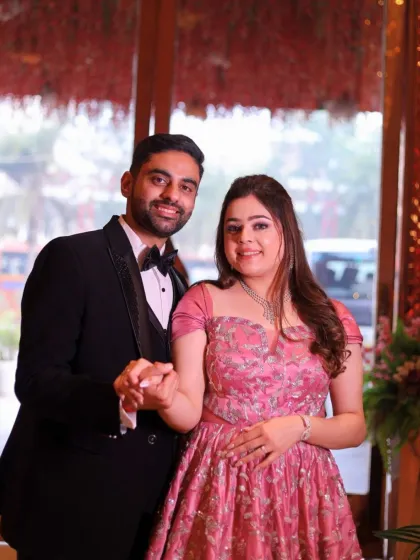 A classic portrait of the happy couple. The bride's makeup is soft and elegant, a perfect match for her beautiful pink gown.