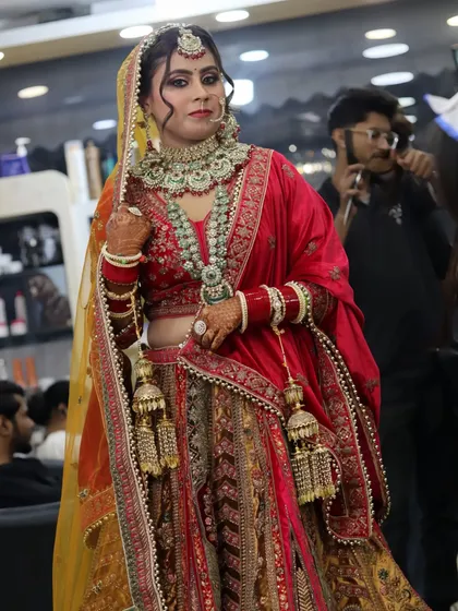 The full bridal look. I work not just on the face, but on the entire presentation, including how the dupatta is set and how the jewelry sits. Every detail matters for the final picture.