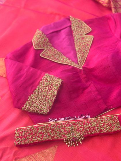 The blouse comes with a matching embroidered belt.