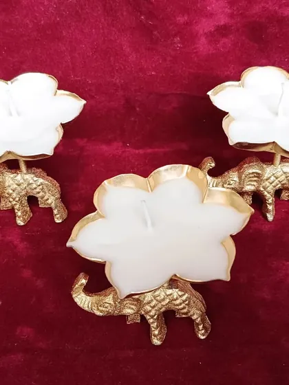 These elephant urli candles add a touch of royal elegance to any setting. A beautifully crafted golden elephant holds a lotus-shaped bowl, making it a perfect item for Diwali decor or as a stately gift.