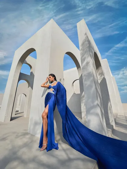 Refractions of elegance, draped in perfection. This active blue sari, inspired by the brilliance of a prism, shimmers with pearl embellishments.