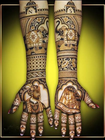 A complete bridal set featuring bride and groom portraits, elephant motifs, and personalized initials 'N' and 'S' at the top. This is a perfect example of a royal and personalized design.