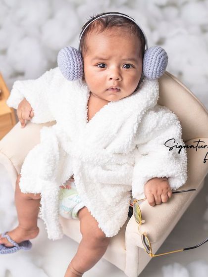 Ready for some tunes, this baby is enjoying his spa day with tiny headphones. We love adding personalized touches to our themes.