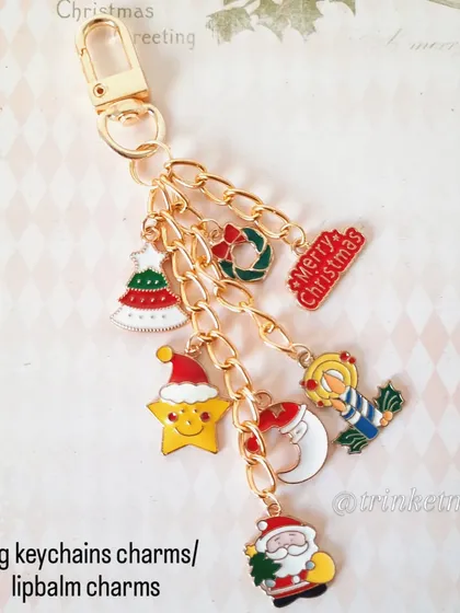 Another look at the fully loaded Christmas charm keychain, perfect for your bag or as a lip balm holder. It's handmade with love and full of festive cheer.