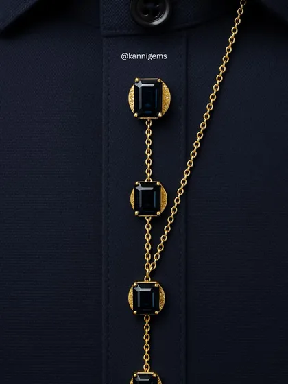 I transform functional details into statements of personal style. This custom button chain, featuring emerald-cut gemstones set in textured gold, is a bespoke creation for a formal shirt or kurta, showcasing how true luxury lies in the details.