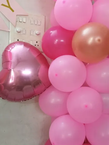 We use a mix of regular and foil balloons to create a rich look for our decorations.