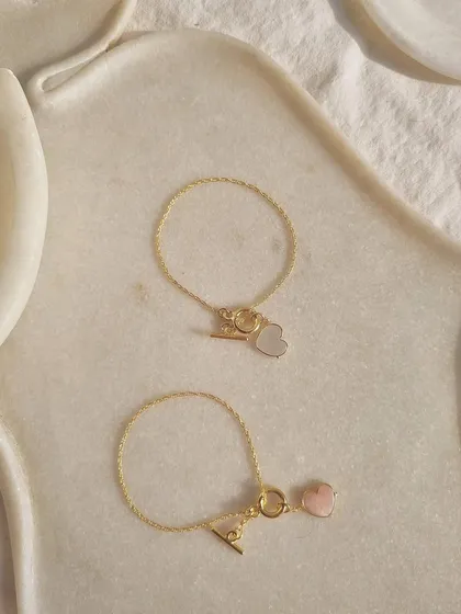My gemstone heart toggle bracelets, perfect for a Rakhi gift or any expression of love. The pink opal heart is for love and prosperity, while the white moonstone heart is for peace and calm.