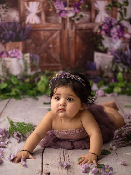 My heart can't help but melt. This sweet girl's gentle gaze during her lavender-themed sitter session is just so precious.