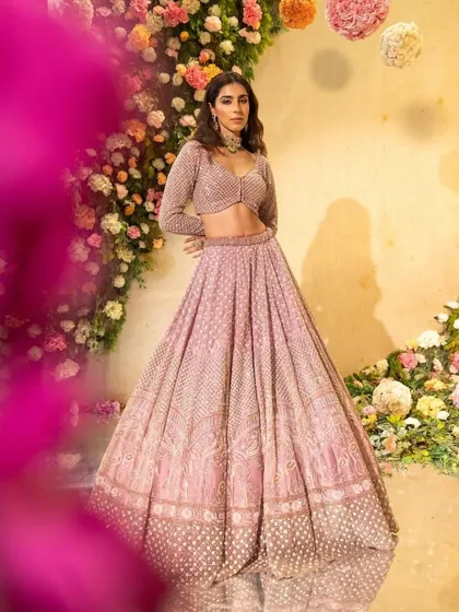 A full-length view of a similar pastel lehenga, showing how different jewellery can change the entire vibe of the look.