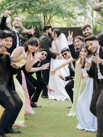 A fun, spontaneous group photo with the entire wedding party striking their best poses.