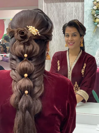 Me with my model, showcasing the final result of this beautiful and intricate hairstyle. I love experimenting with new and creative hair designs.
