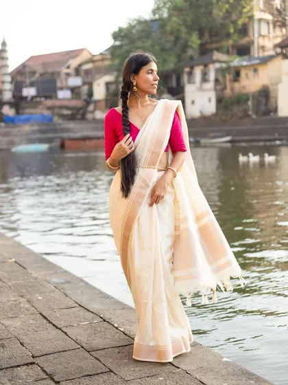 An elegant silk saree against a rustic ghat. This is a perfect example of my outdoor lifestyle photography, where I use natural light and location to tell a story and create a specific mood.