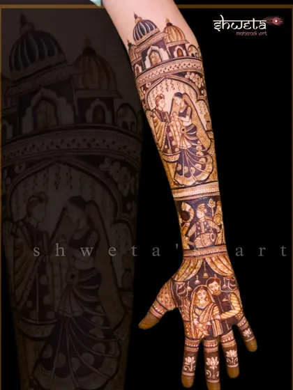 This full-arm design captures multiple wedding moments. From the bride and groom's portrait on the palm to the varmala ceremony on the forearm, it tells a complete wedding story.