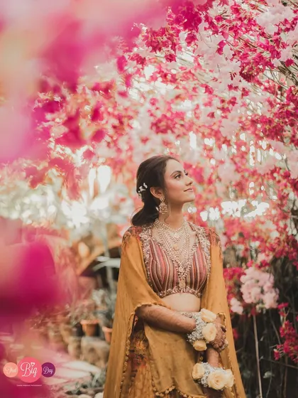 A bride framed by blossoms, looking towards her future. Our bridal portrait sessions are about more than just a beautiful photo; they are about capturing the soul of the woman at the heart of the story.