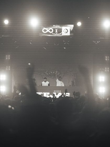 A black and white photo of the crowd and stage at IIT Patna, creating a timeless concert feel.